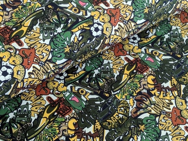 Corileo Stoff »Baumwolljersey Comic Graffiti Kids Fussball Grün Stoff Meterware Jersey«